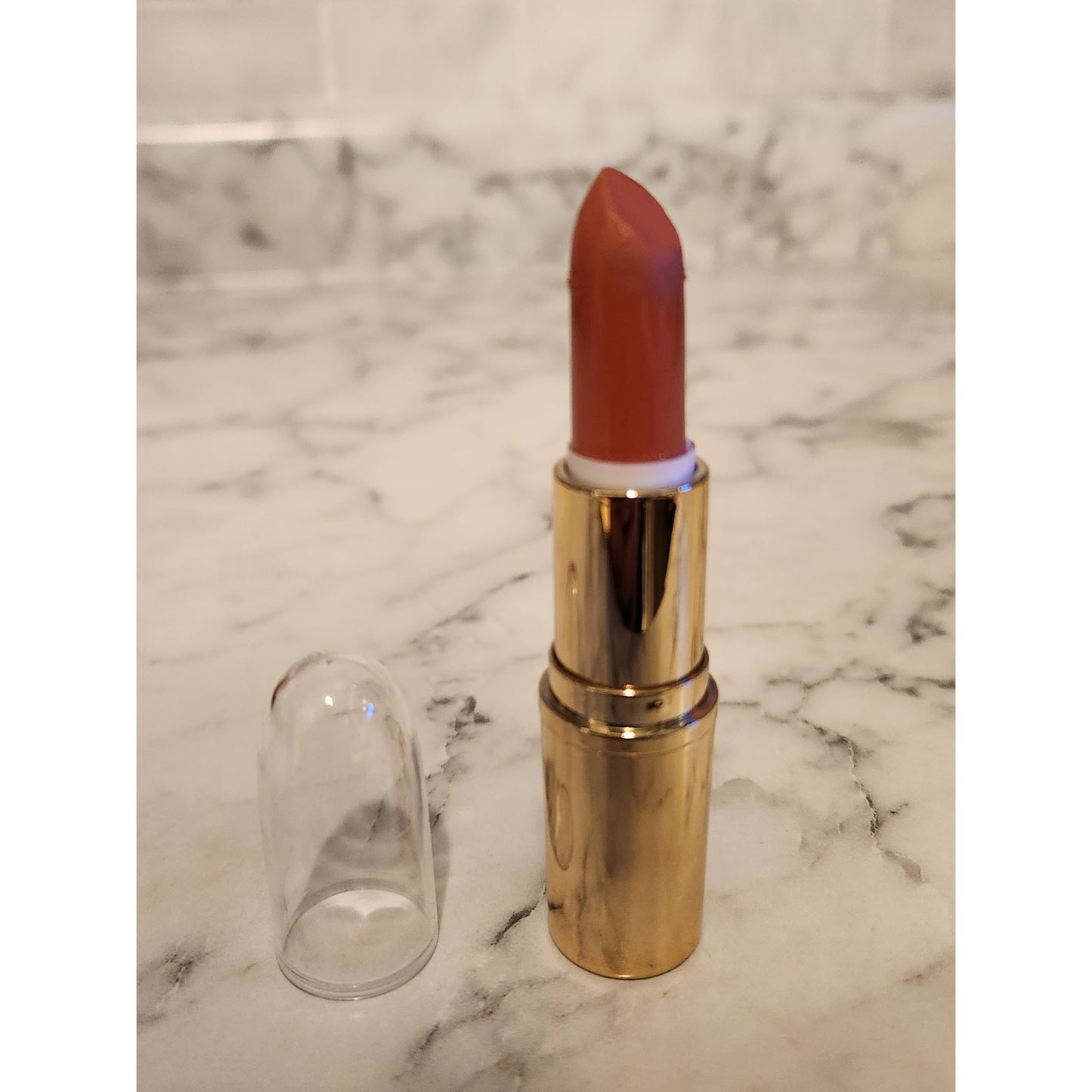 Gold-Tone Lipstick Tube With Clear Cap