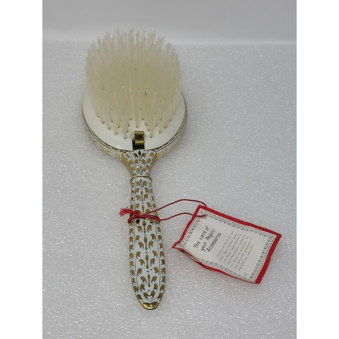 This is The Regent Removable Hair Brush Vanity White Lace / Pink Rose Gold Tone