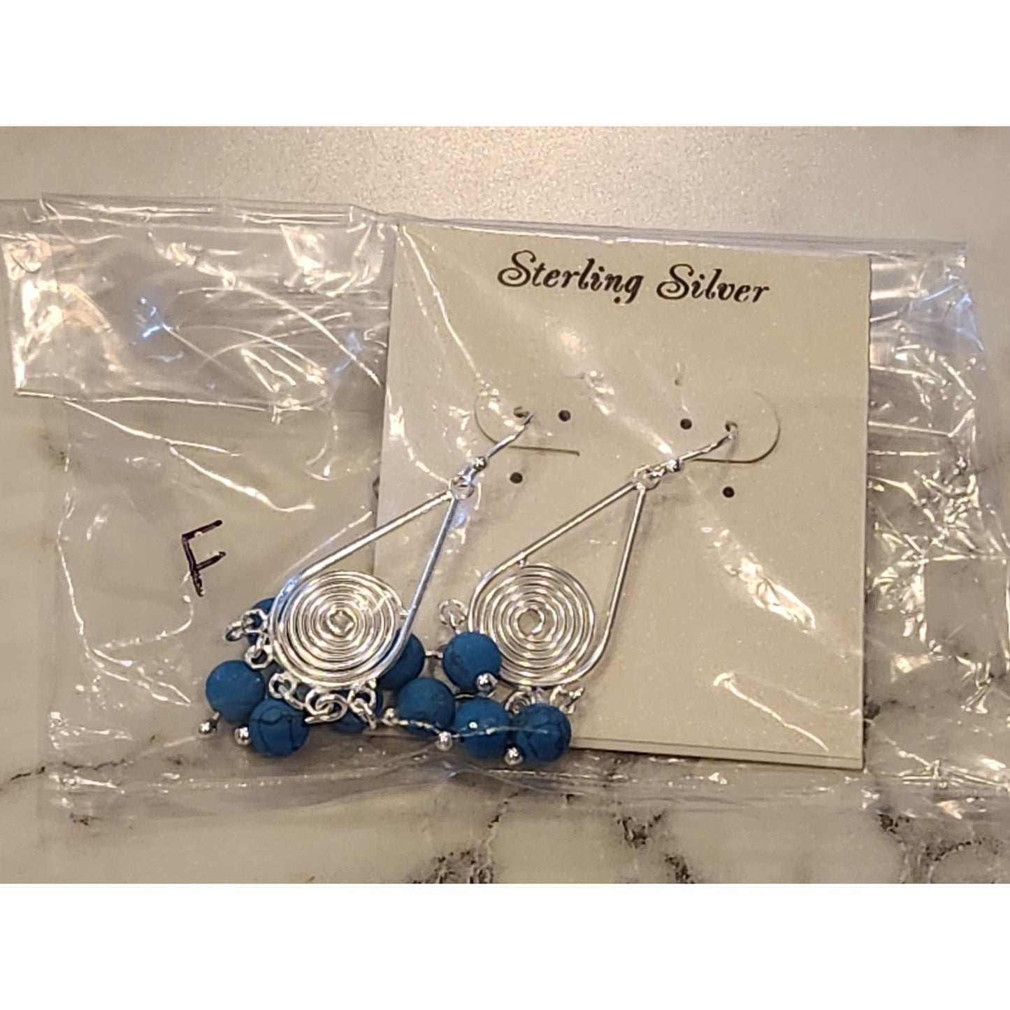 Sterling Silver Spiral Drop Earrings With Blue Beads