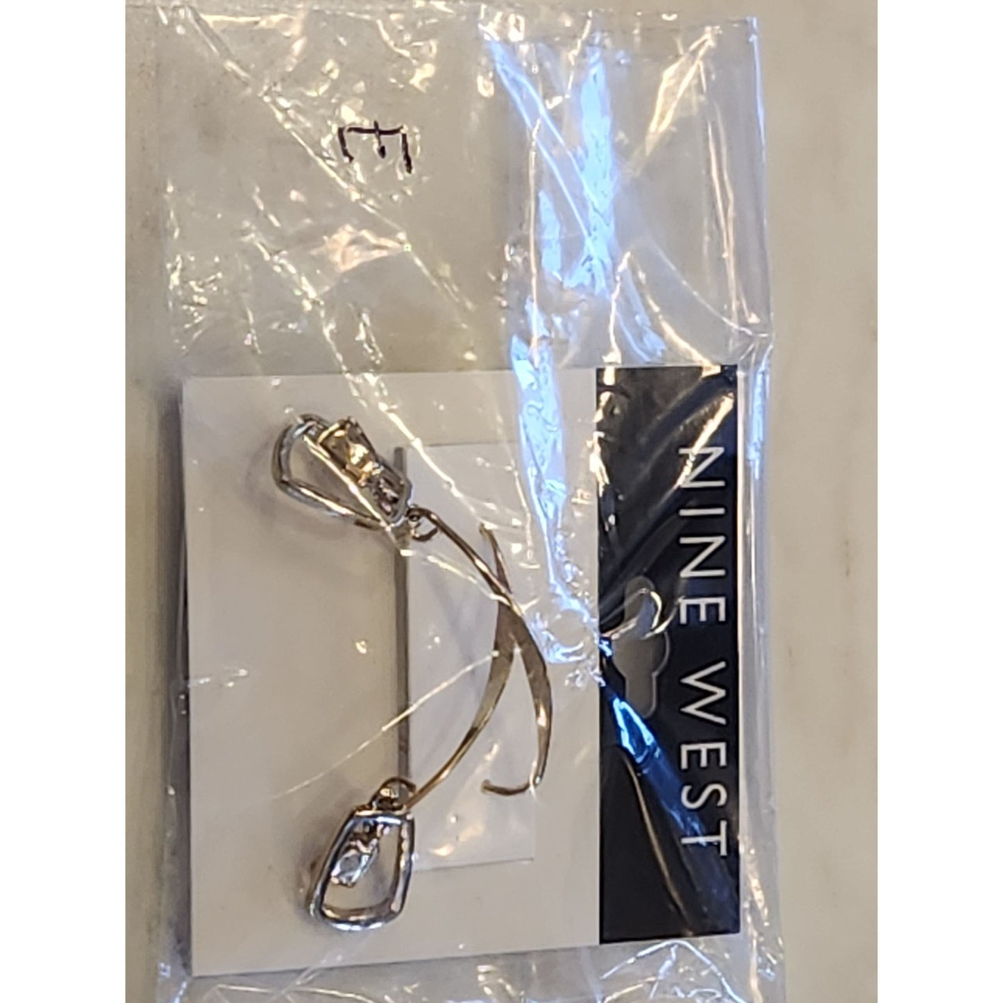 Nine West Gold-Tone Drop Earrings With Abstract Charm Design