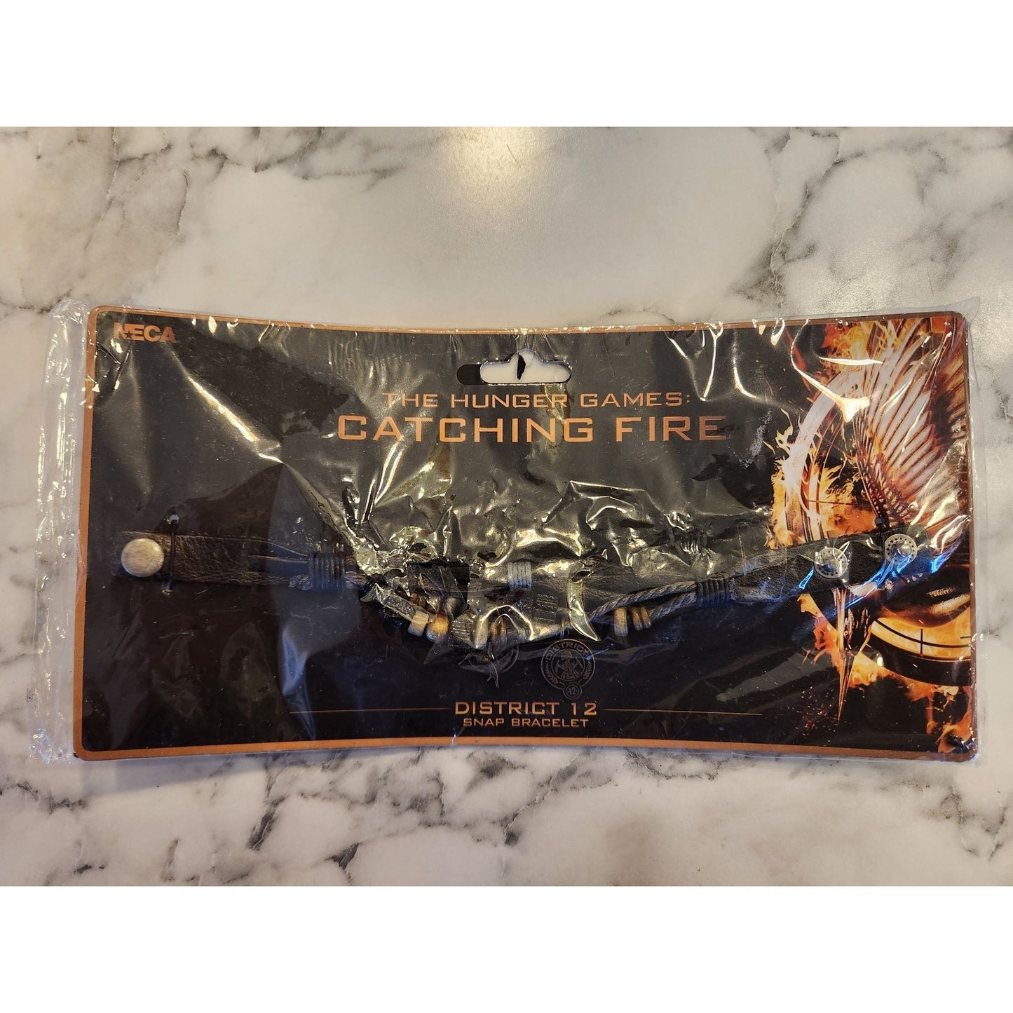 The Hunger Games Catching Fire District 12 Snap Bracelet By NECA