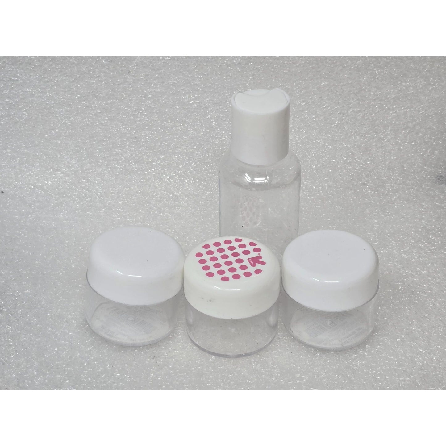 Travel-Size Clear Plastic Bottles Set of 4 With Lids For Toiletries Cosmetics