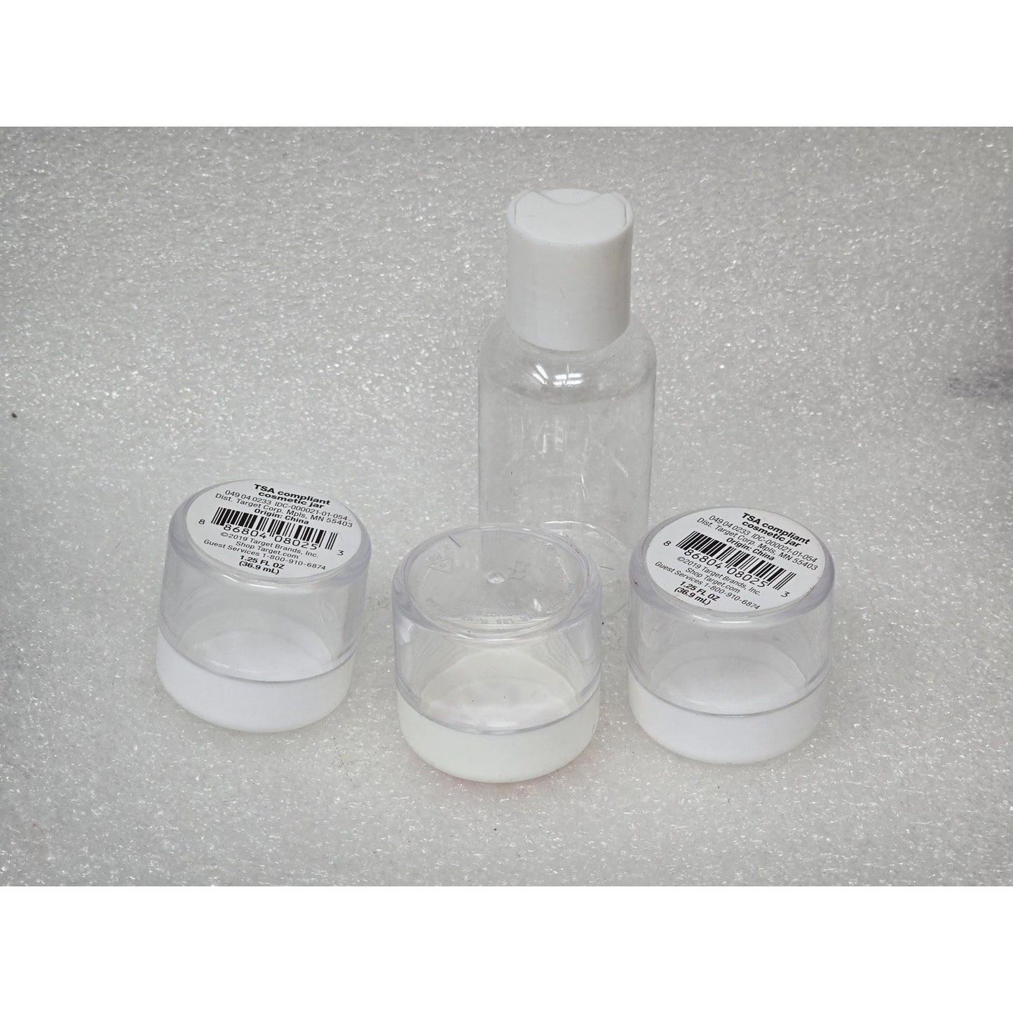 Travel-Size Clear Plastic Bottles Set of 4 With Lids For Toiletries Cosmetics